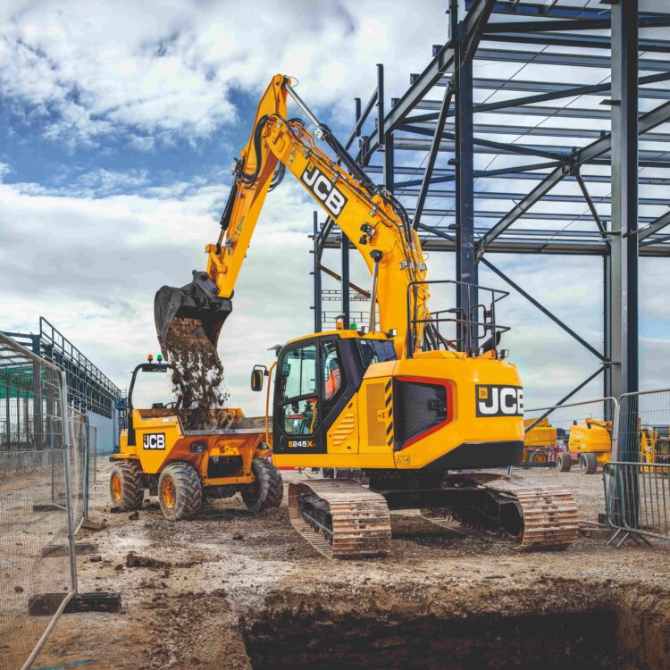 Excavator and forward tipping dump truck on a construction site