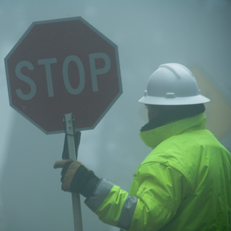 Person with stop sign