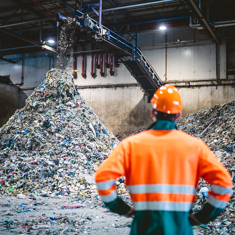 Man in waste warehouse