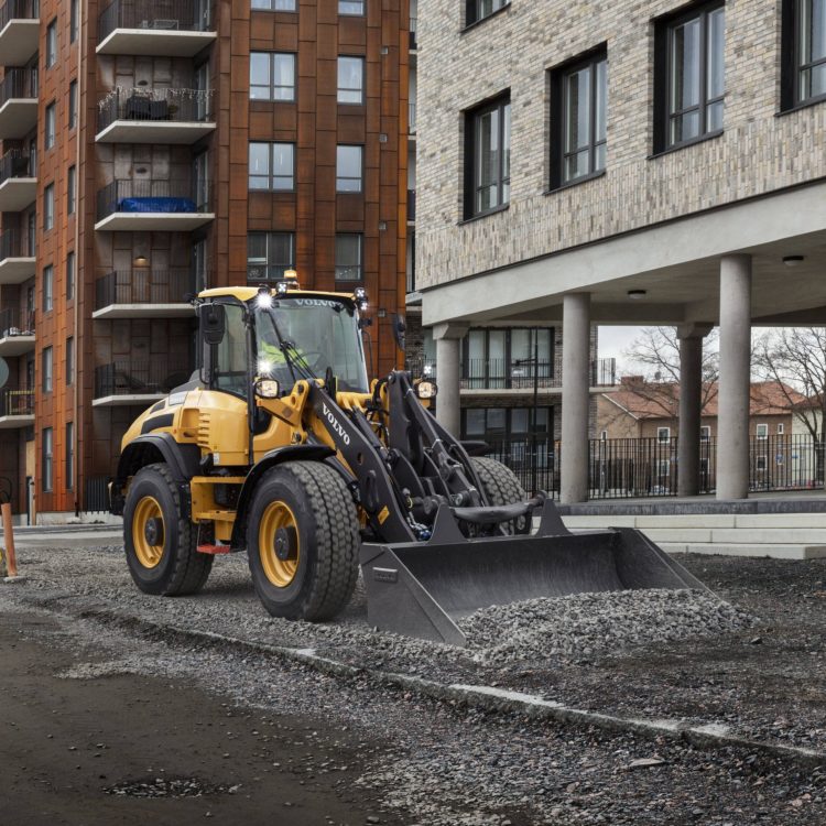 Wheel Loader Spreading Gravel on Construction Site
