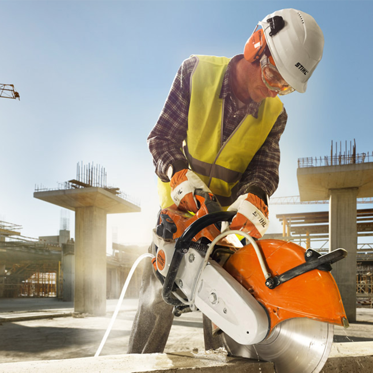 Man using abrasive wheel machine