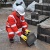 Man lifting brick