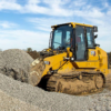 Tracked Loader lifting gravel