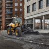 Wheel Loader Spreading Gravel on Construction Site